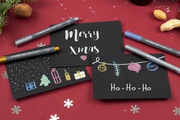 Selfmade Christmas cards with metallic designs