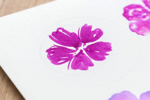 Watercolour technique with watercolour brush pens "dry-on-dry": Pink drawn flowers on white watercolour paper